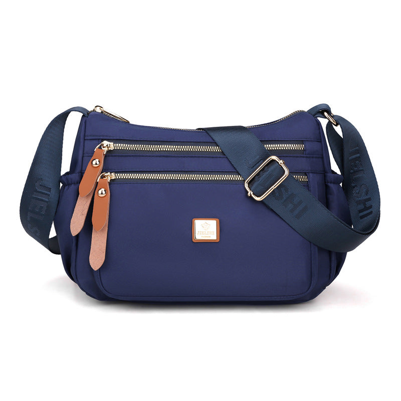 Multi-compartment shoulder bag