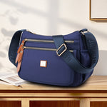 Multi-compartment shoulder bag